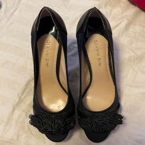 Gently used Gianni Bini black heels with tassel design